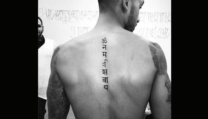 Arsenal star Theo Walcott unveils &#039;Om Namah Shivaya&#039; tattoo, fans lose calm on Twitter