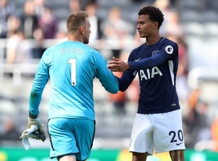 Tottenham midfielder Dele Alli shakes hands with Rob Elliot