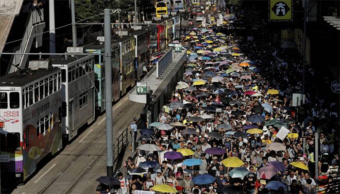 Crowds rally in Hong Kong after activists jailed