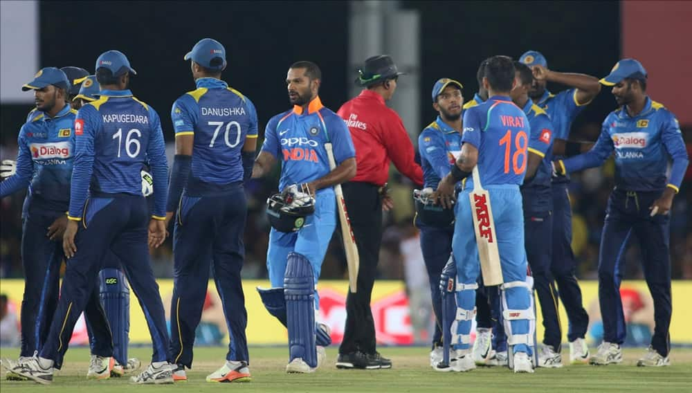 Indian skipper Virat Kohli and Shikhar Dhawan leave the field