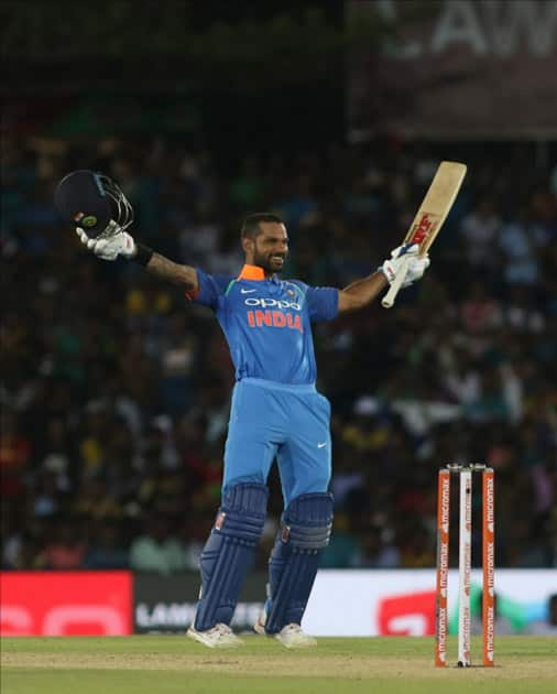 Shikhar Dhawan of India celebrates his century