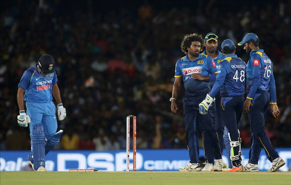 Sri Lankan cricketers celebrate fall of Rohit Sharma' wicket