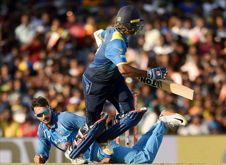 Axar Patel and Sri Lanka's Lasith Malinga in action