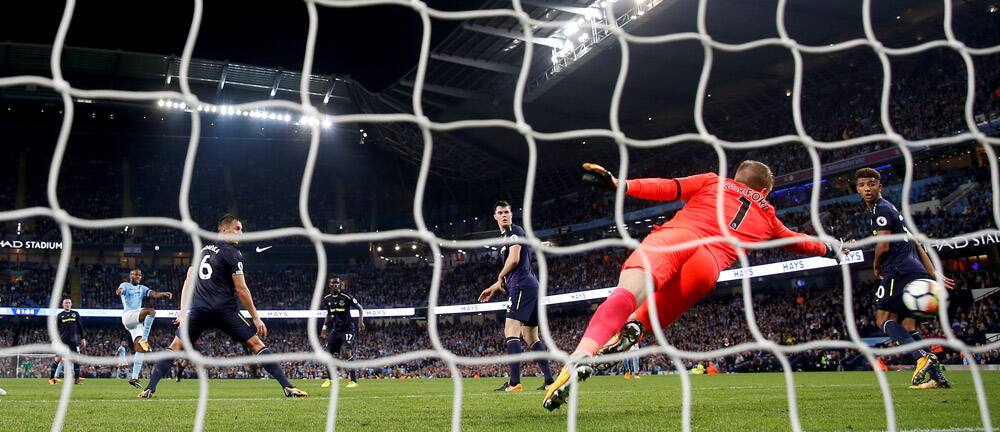 Everton's Jordon Pickford saves a shot against Manchester City