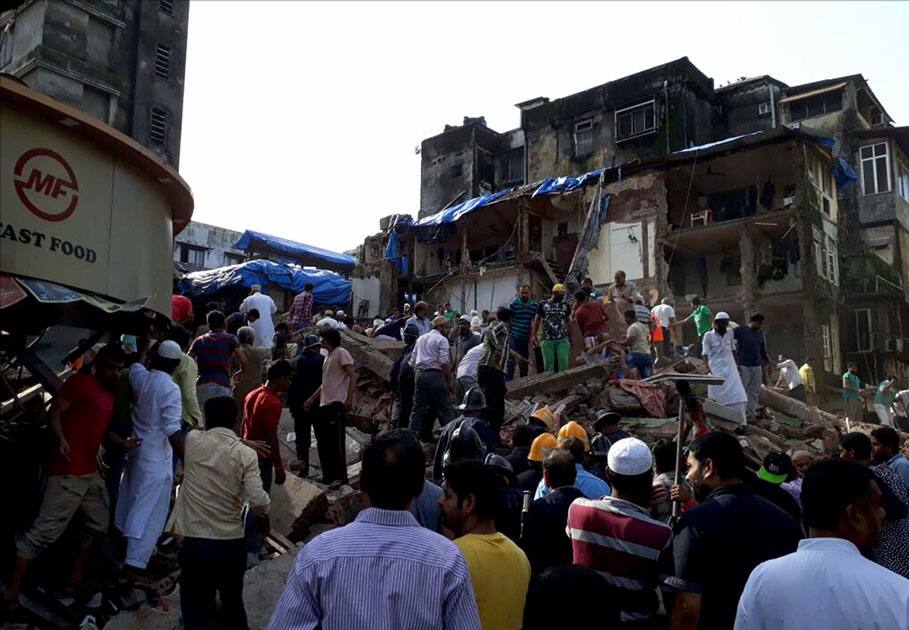 Rescue efforts going on as a five-storey building Rescue efforts going on as a five-storey building