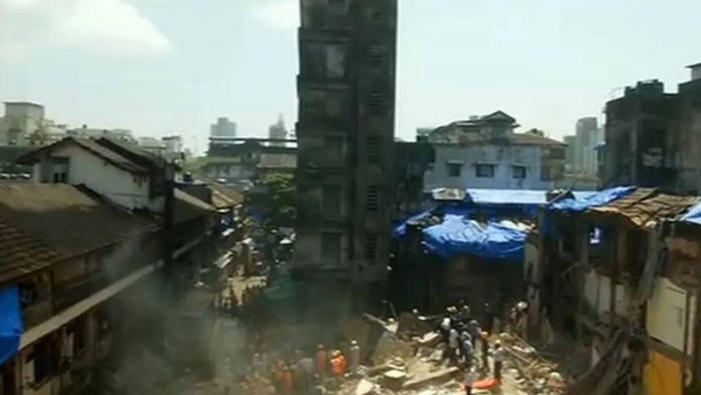 Personnel are seen after a building collapsed in Mumbai Personnel are seen after a building collapsed in Mumbai