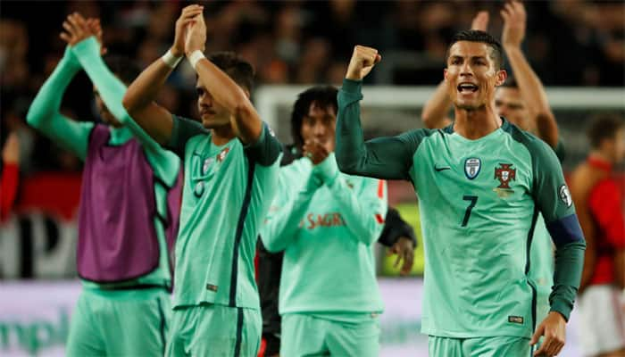 Portugal hang on to win bruising battle with 10-man Hungary