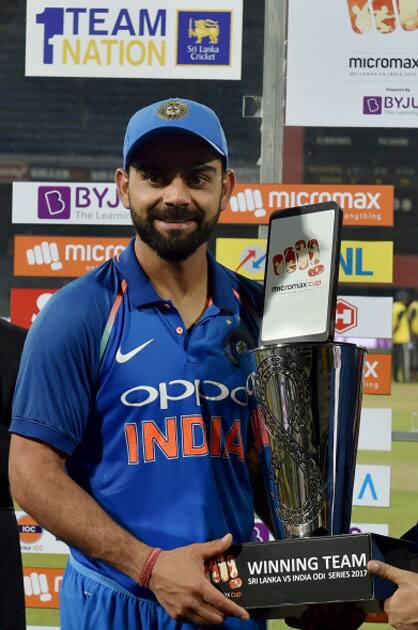 India's captain Virat Kohli holds the winners trophy India's captain Virat Kohli holds the winners trophy