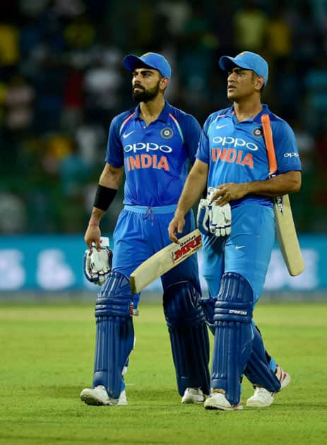 Virat Kohli and Mahendra Singh Dhoni leaves the ground after their win in the match Virat Kohli and Mahendra Singh Dhoni leaves the ground after their win in the match