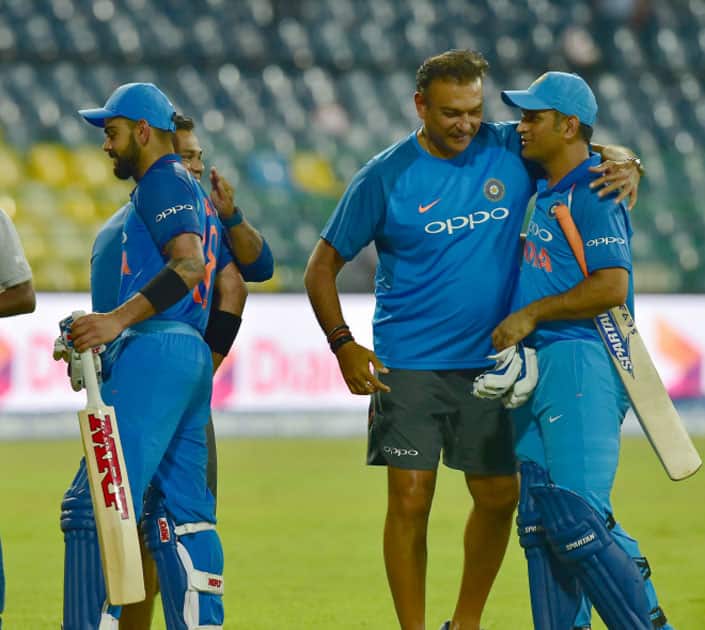 India's team coach Ravi Shastri greets M S Dhoni and Virat Kohli India's team coach Ravi Shastri greets M S Dhoni and Virat Kohli