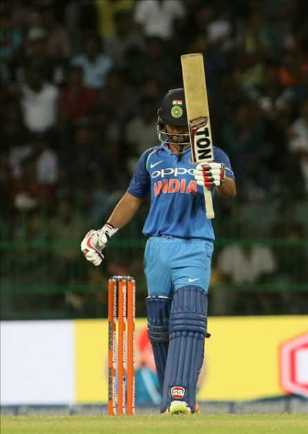 India's Kedar Jadhav celebrates his half century India's Kedar Jadhav celebrates his half century