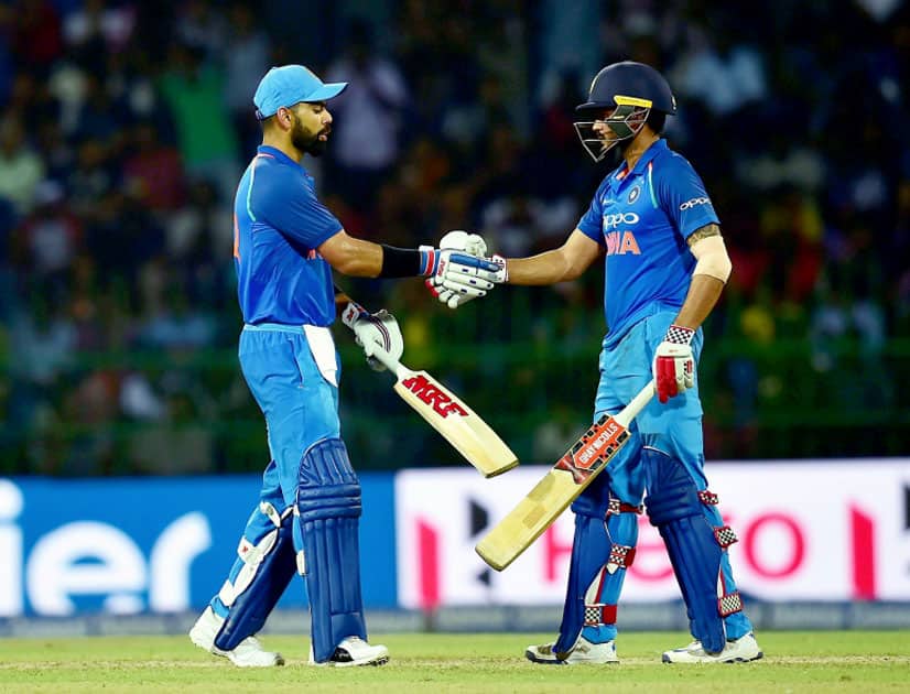 India's Virat Kohli greets by M Pandey after his fifty India's Virat Kohli greets by M Pandey after his fifty