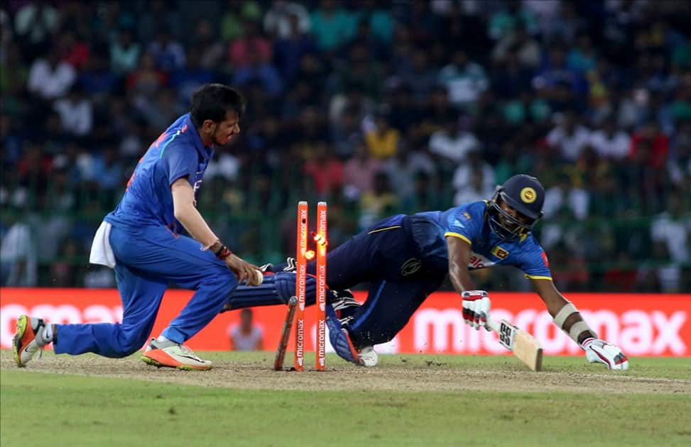 Wanindu Hasaranga of Sri Lanka being run out by India's Yuzvendra Chahal Wanindu Hasaranga of Sri Lanka being run out by India's Yuzvendra Chahal