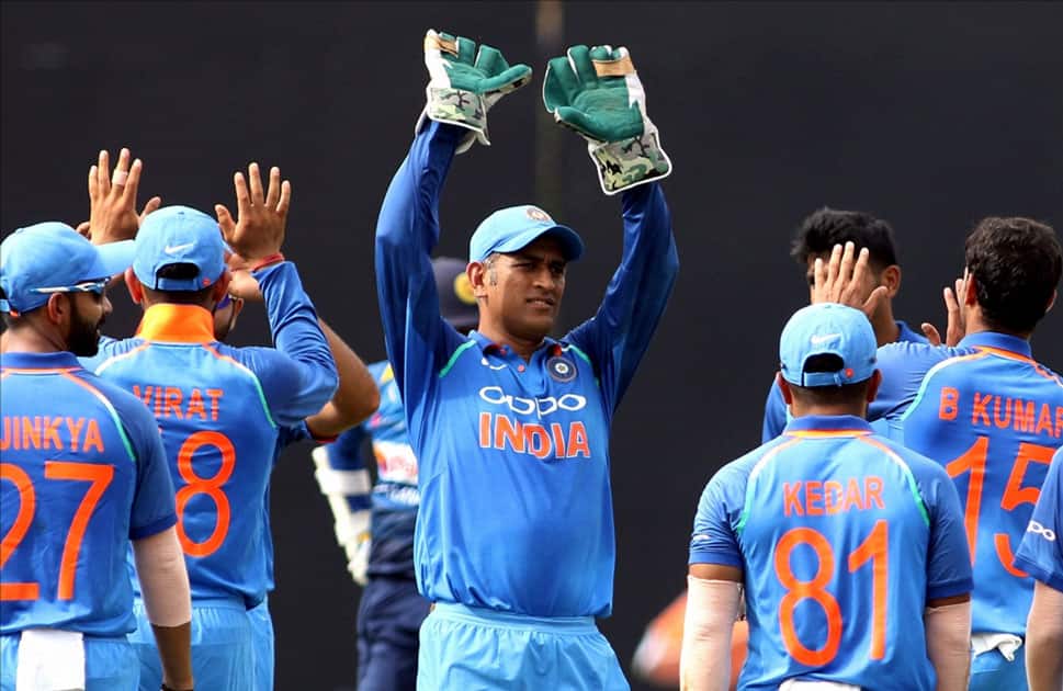 India's MS Dhoni along with teammates celebrates fall of Dilshan Munaweera's wicket India's MS Dhoni along with teammates celebrates fall of Dilshan Munaweera's wicket
