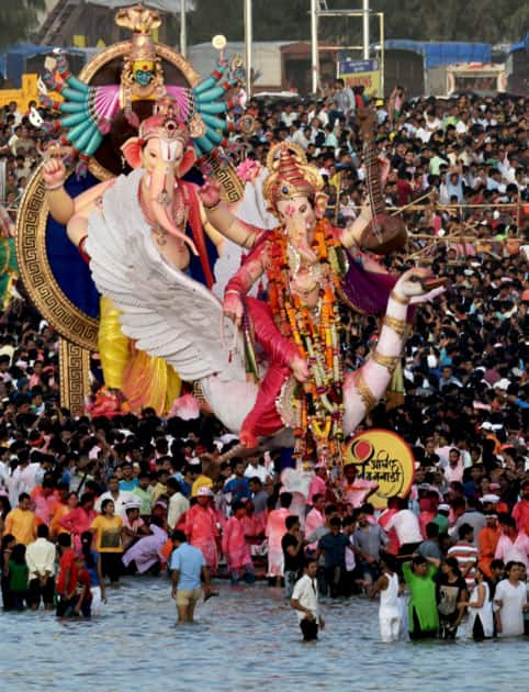 People carry Ganesh idol for immersion at Girgoan