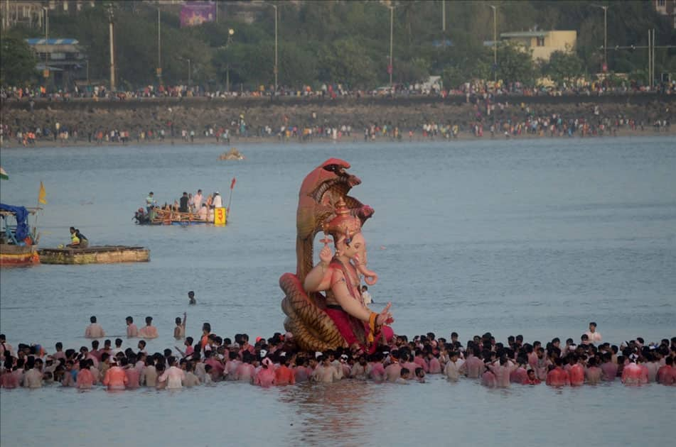 Ganesh immersion underway at Girgaum sea beach in Mumbai.