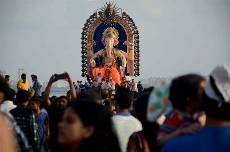 Ganesh immersion underway at Girgaum sea beach in Mumbai.