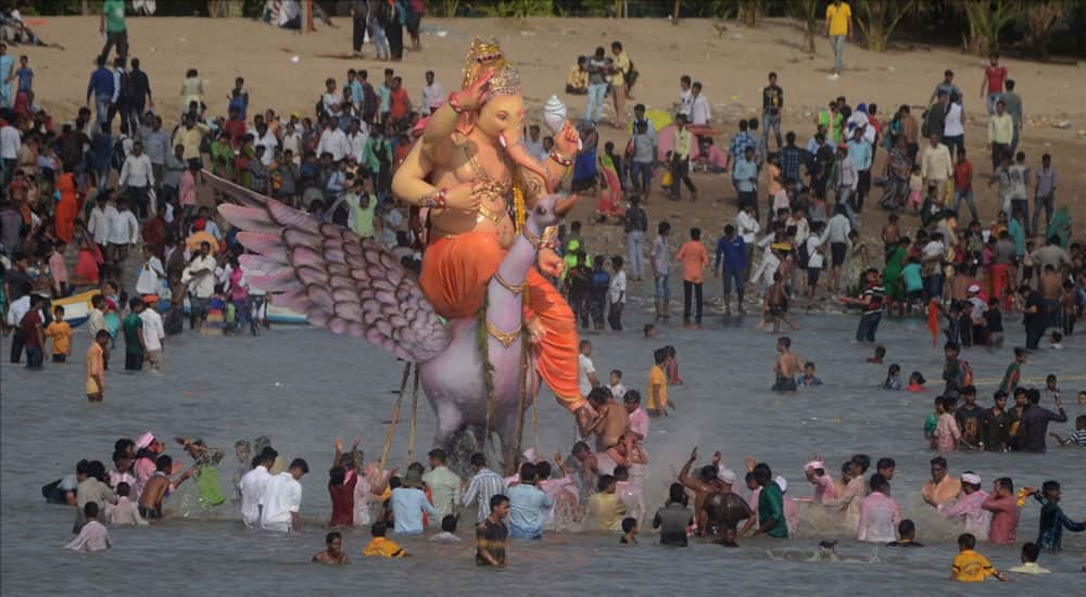 Ganesh immersion underway at Girgaum sea beach in Mumbai.