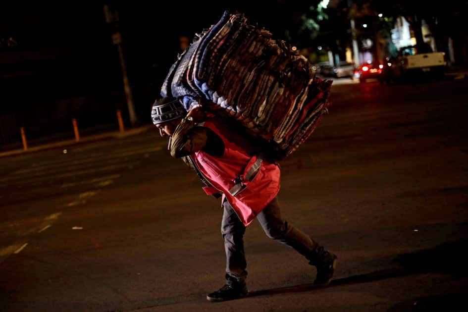 A volunteer carries blankets after an earthquake hit Mexico City