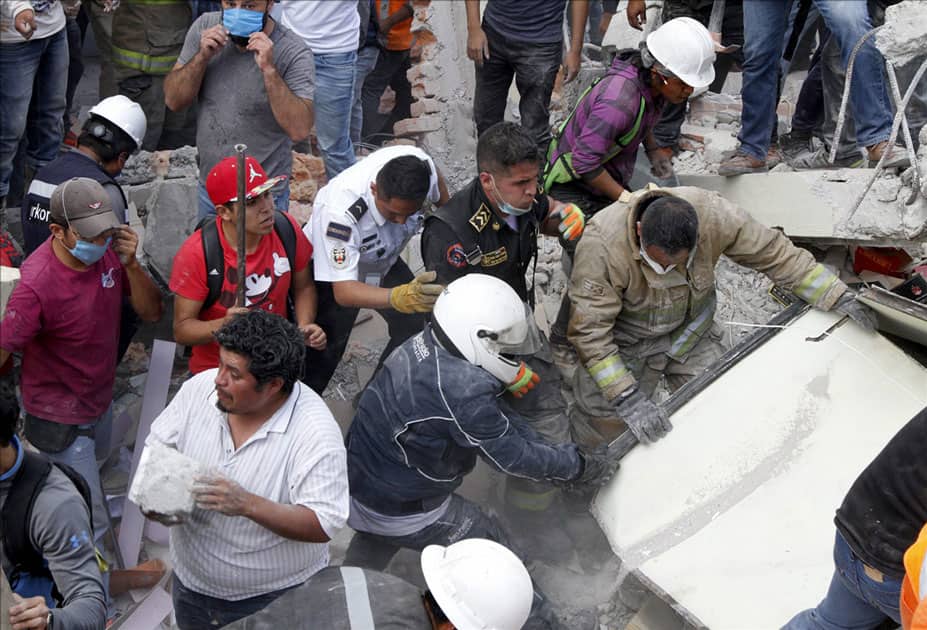 Rescuers and volunteers work after an earthquake in Mexico City, capital of Mexico