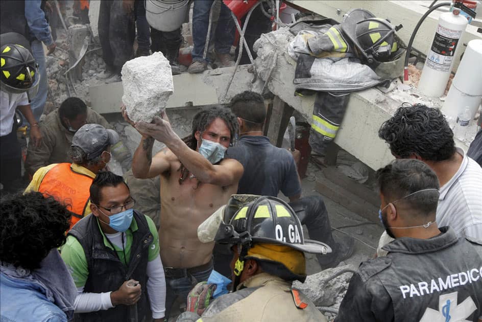 Rescuers and volunteers work after an earthquake in Mexico City, capital of 