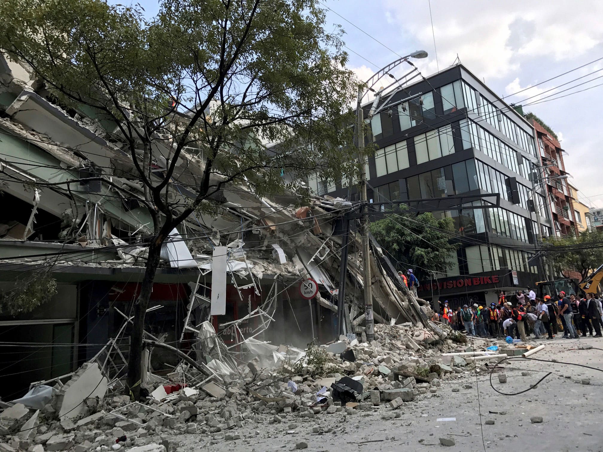 A collapsed building is seen after an earthquake hit in Mexico City, Mexico