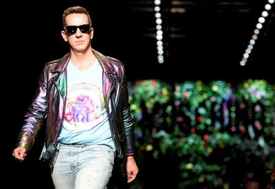 Designer Jeremy Scott acknowledges the applause at the end of the Moschino Spring/Summer 2018 show at the Milan Fashion Week in Milan.