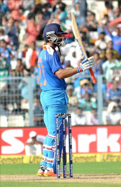India's Ajinkya Rahane celebrates his half century during the second ODI cricket match between India and Australia at Eden Gardens in Kolkata. India's Ajinkya Rahane celebrates his half century during the second ODI cricket match between India and Australia at Eden Gardens in Kolkata.