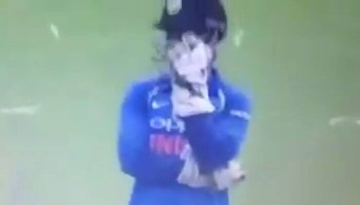 Watch: MS Dhoni tries to hide his face out of embarrassment