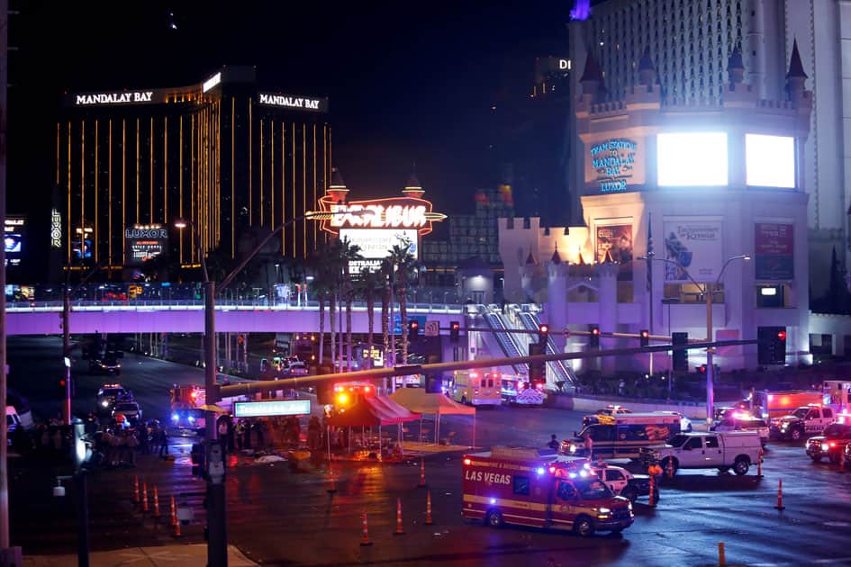 Las Vegas Metro Police and medical workers stage in the intersection of Tropicana Avenue and Las Vegas Boulevard South after a mass shooting at a music festival on the Las Vegas Strip in Las Vegas.