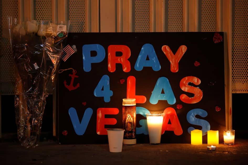 A sign is pictured at a vigil on the Las Vegas strip following a mass shooting at the Route 91 Harvest Country Music Festival in Las Vegas.