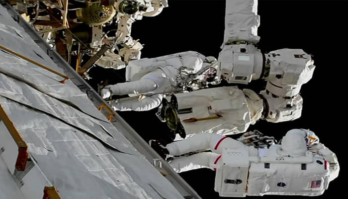 NASA astronauts complete first of three spacewalks, robot arm repair successful