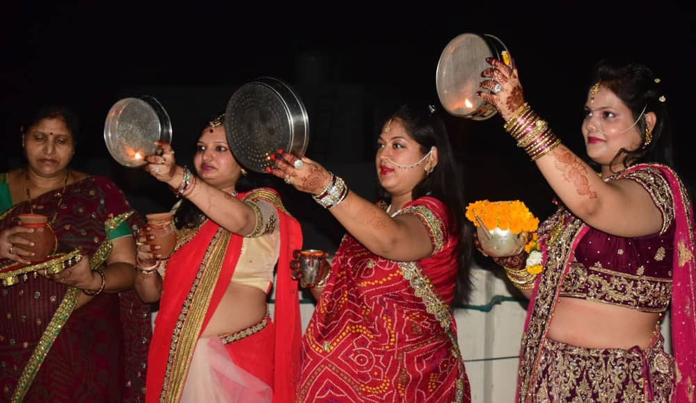 Women celebrate Karva Chauth in Mathura.