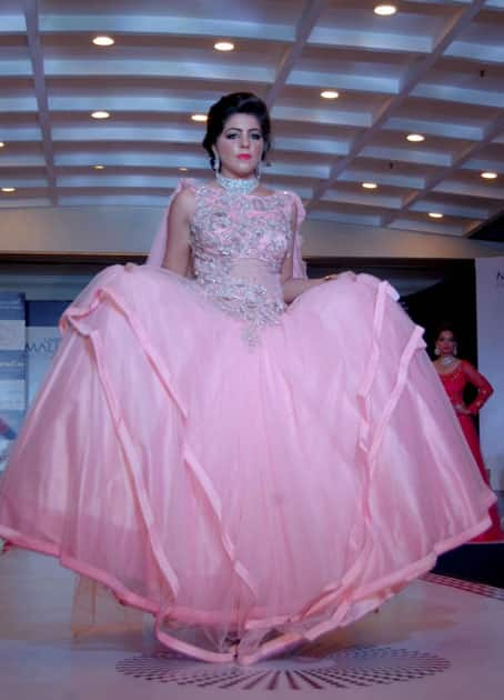 A woman walks the ramp during a fashion show organized on Karva Chauth in Amritsar.