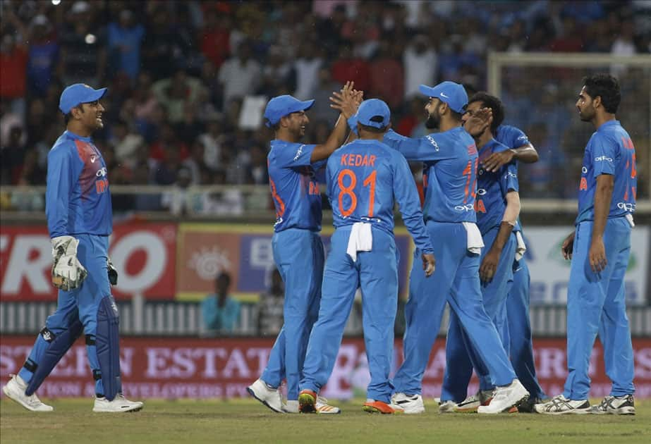 MS Dhoni and Jasprit Bumrah of India celebrate fall of Daniel Christian's wicket during the first T20 match between India and Australia at JSCA International Stadium in Ranchi.