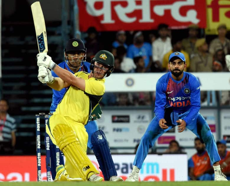 Australian player Travis Head plays a shot during their second T20 cricket match against India, in Guwahati.