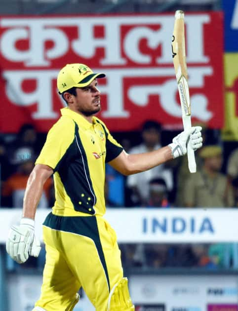 Australian player Moises Henriques celebrates his fifty runs during their second T20 cricket match against India, in Guwahati.