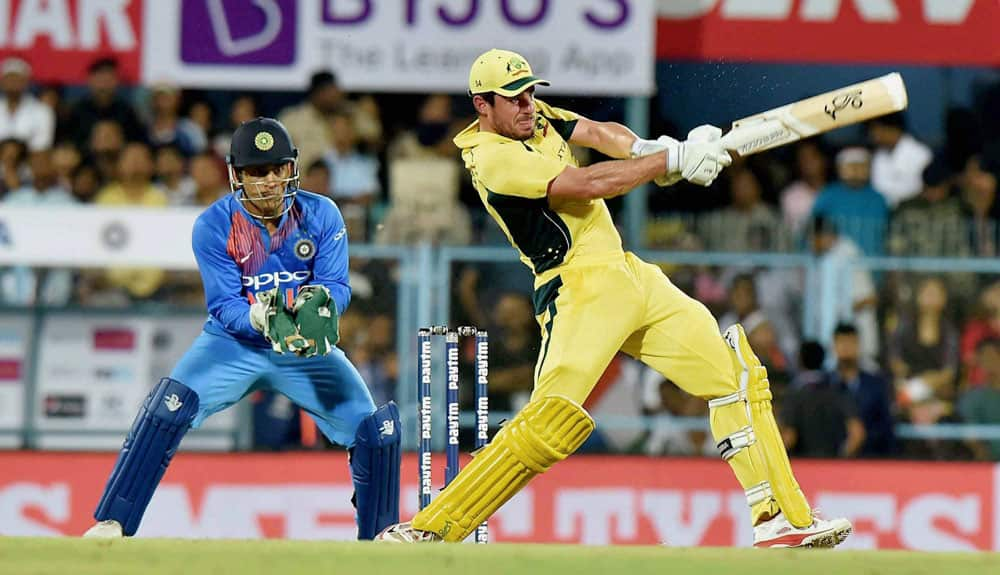 Australian player Moises Henriques plays a shot during their second T20 cricket match against India, in Guwahati.