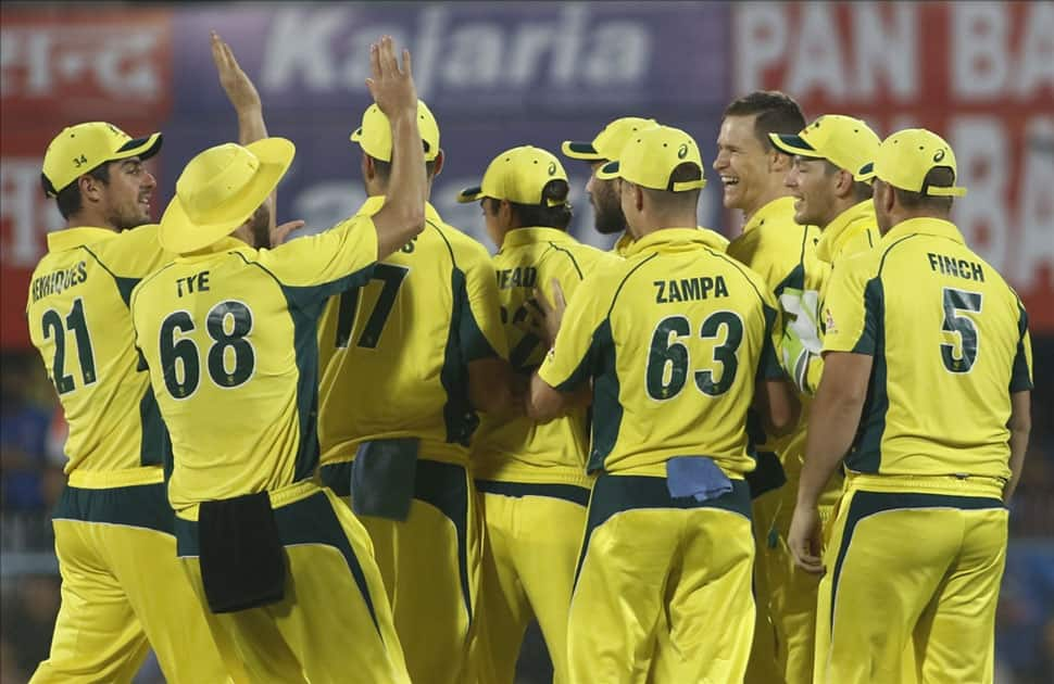 Australia's Jason Behrendorff, celebrates fall of Virat Kohli's wicket during the second T20 match between India and Australia at Barsapara Cricket Stadium in Guwahati.