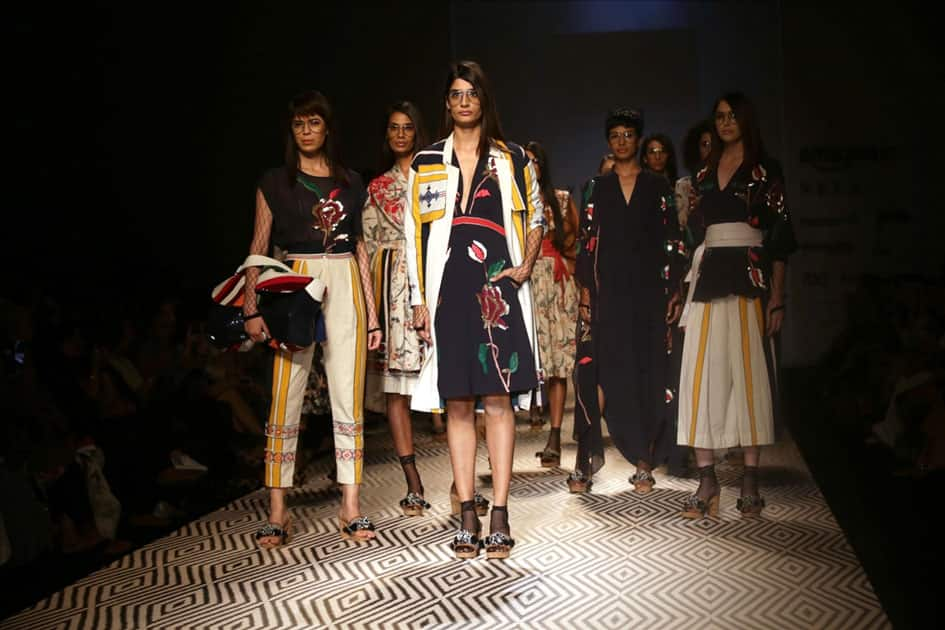 Models walk the ramp showcasing the creations of fashion designer Vineet Bahl at Amazon India Fashion Week Summer Spring in New Delhi.