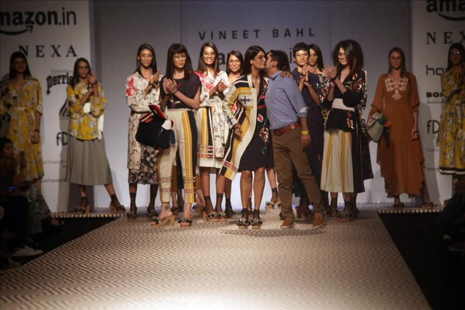 Models walk the ramp showcasing the creations of fashion designer Vineet Bahl at Amazon India Fashion Week Summer Spring in New Delhi.