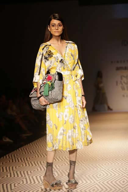 Models walk the ramp showcasing the creations of fashion designer Vineet Bahl at Amazon India Fashion Week Summer Spring in New Delhi.