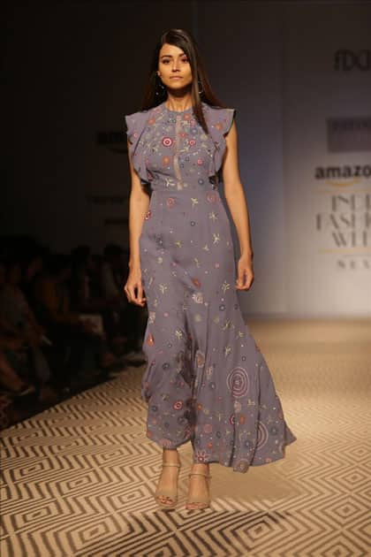 Models walk the ramp showcasing the creations of fashion designer PATINE at Amazon India Fashion Week Summer Spring, in New Delhi.