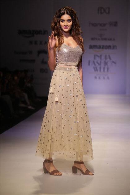 Actress Nidhhi Agerwal walk the ramp showcasing the creations at Amazon India Fashion Week Summer Spring, in New Delhi.