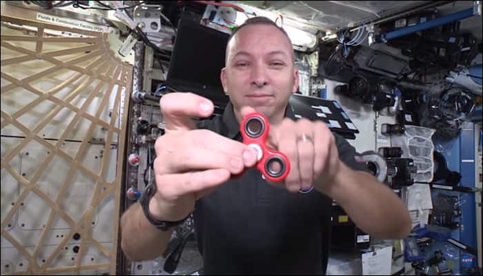 Feeling fidgety? ISS astronauts have fun with a fidget spinner in space - Watch