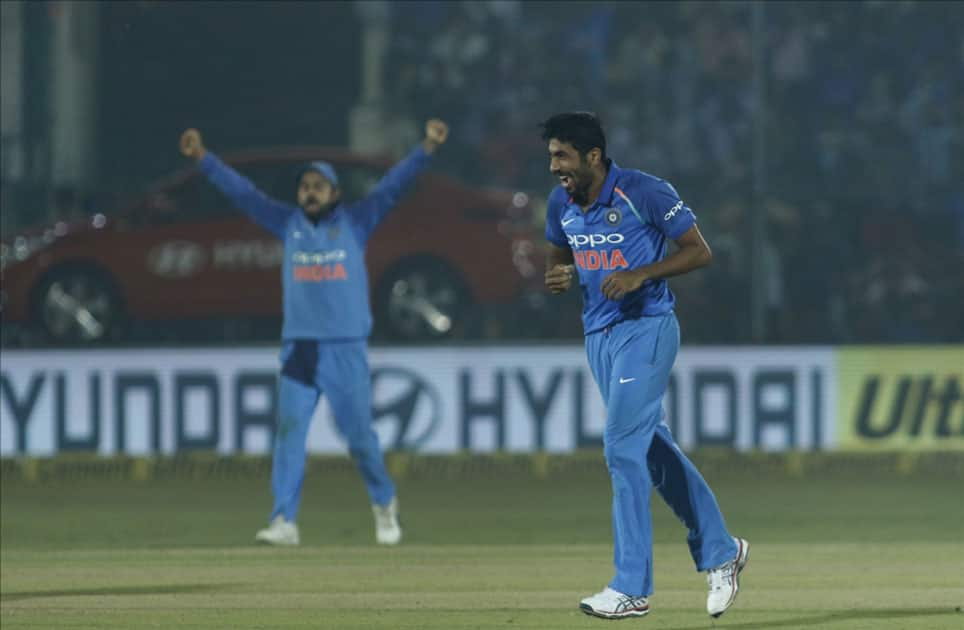 Jasprit Bumrah of India celebrates fall of Ross Taylor's wicket during the third ODI match between India and New Zealand at Green Park Stadium in Kanpur.