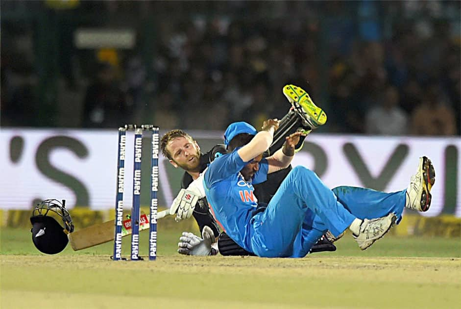 New Zealand batsman Kane Williamson and India's Hardik Pandya falling after a collision during 3rd ODI cricket match against India at Green Park Stadium in Kanpur