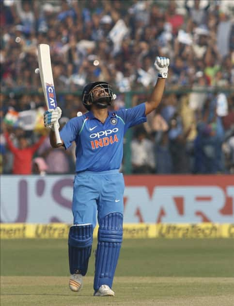 Rohit Sharma of India celebrates his century during the third ODI match between India and New Zealand at Green Park Stadium in Kanpur.