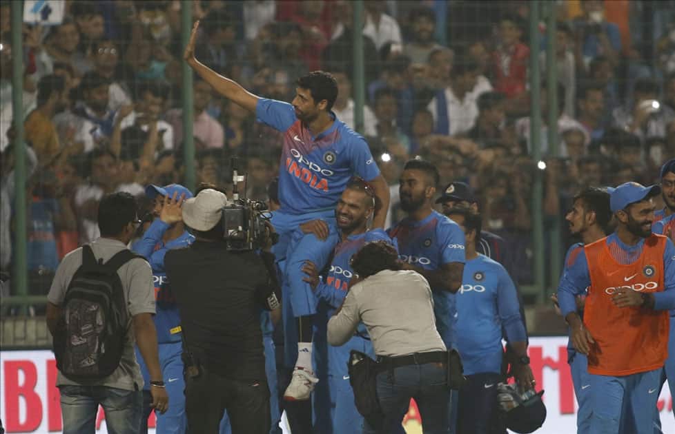 India's Ashish Nehra along with teammates celebrates after the end of the first T20 match between India and New Zealand at Feroz Shah Kotla stadium in New Delhi.