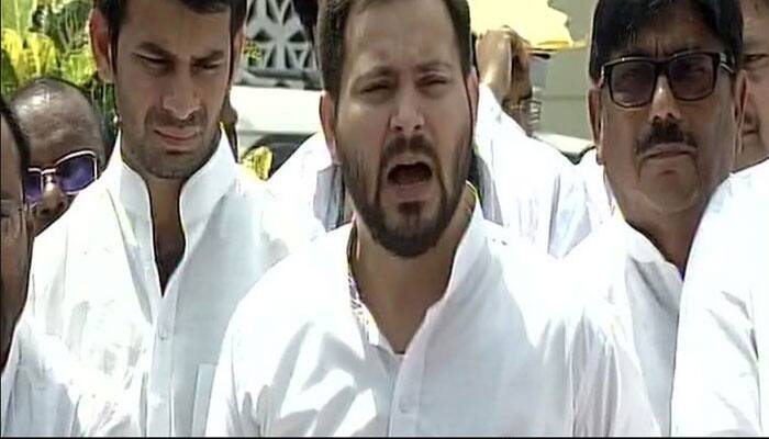 JD(U) releases old photo of Tejashwi with woman, RJD scion hits back